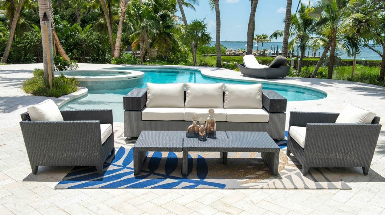 Custom outdoor sofa and seating set installed near pool and spa in North Florida, designed for durable and elegant outdoor living.
