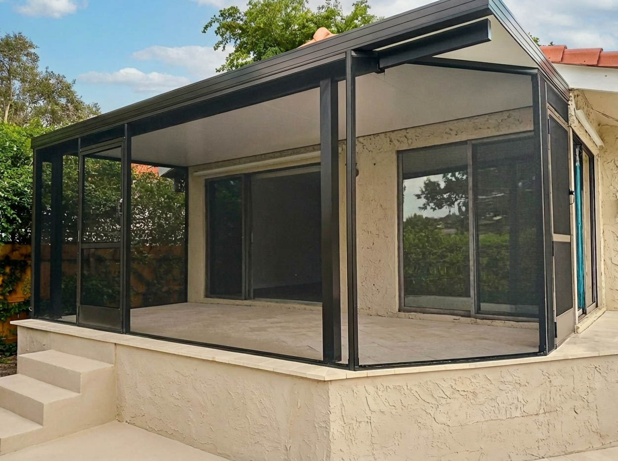 Side patio screen enclosure installed to expand usable outdoor space and improve privacy for Florida homeowners.