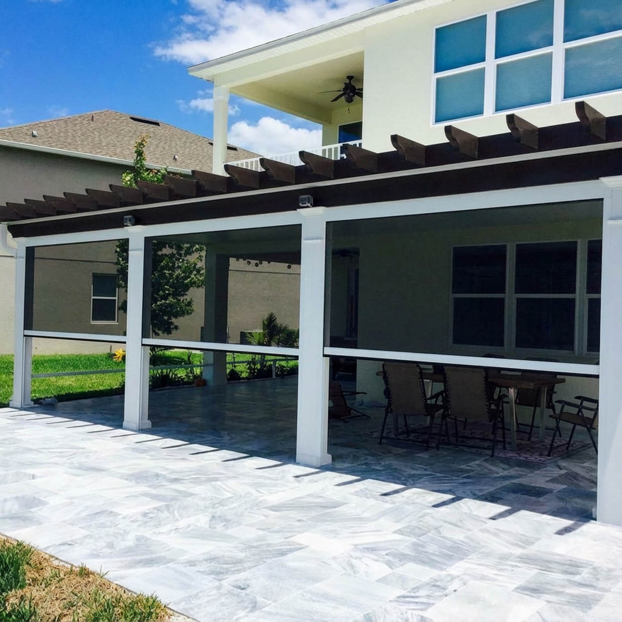 Flat roof patio screen enclosure designed for modern Florida homes, offering a clean architectural look and outdoor protection.