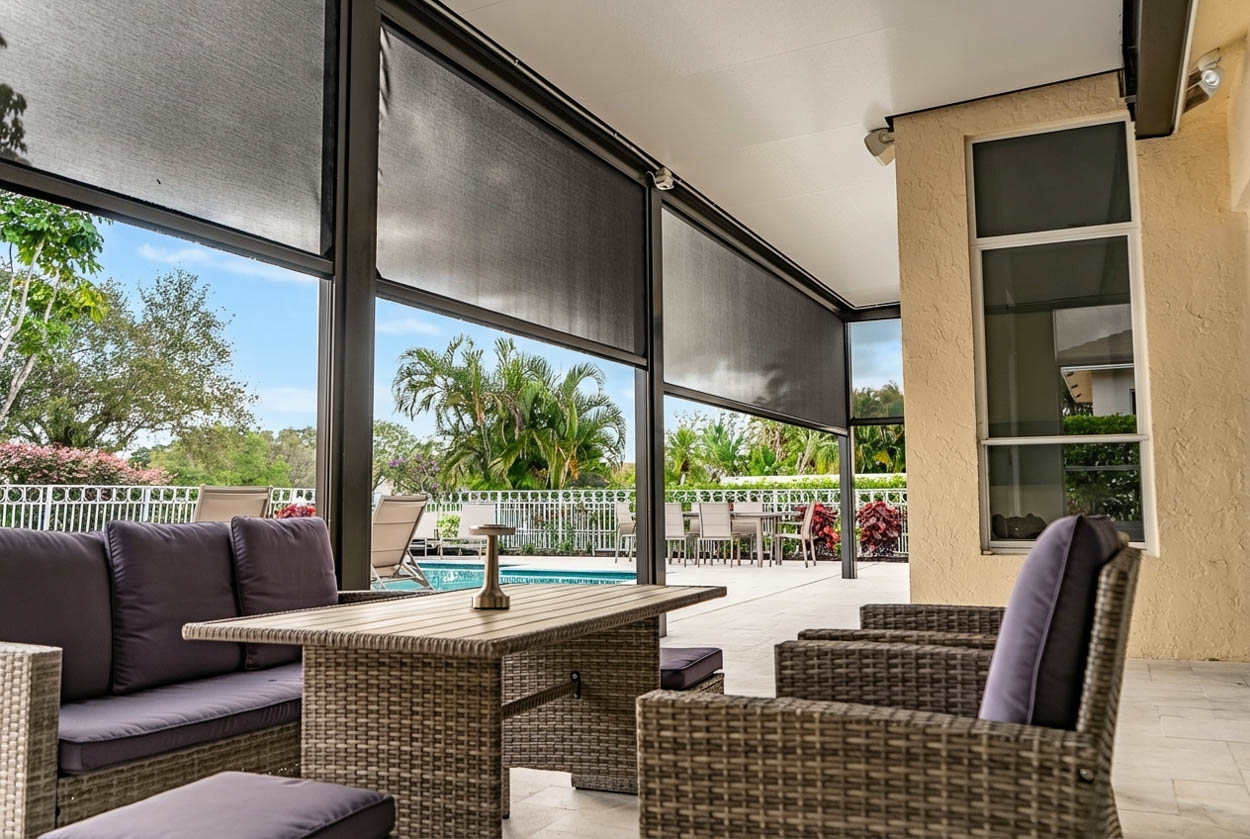 Custom patio screen enclosure solution providing partial enclosure for enhanced airflow, shade, and insect control in Florida.