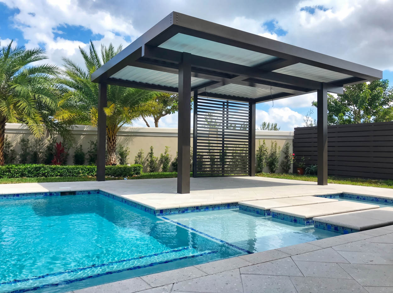 Modern aluminum pergola installed beside pool by Florida contractors, featuring clean lines and durable outdoor construction.