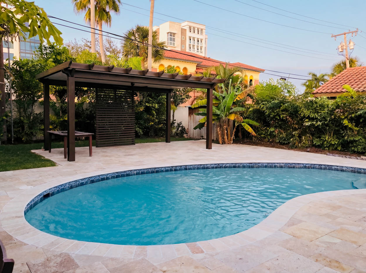 Contemporary pergola construction for residential patio in Florida, built by licensed outdoor living contractors.