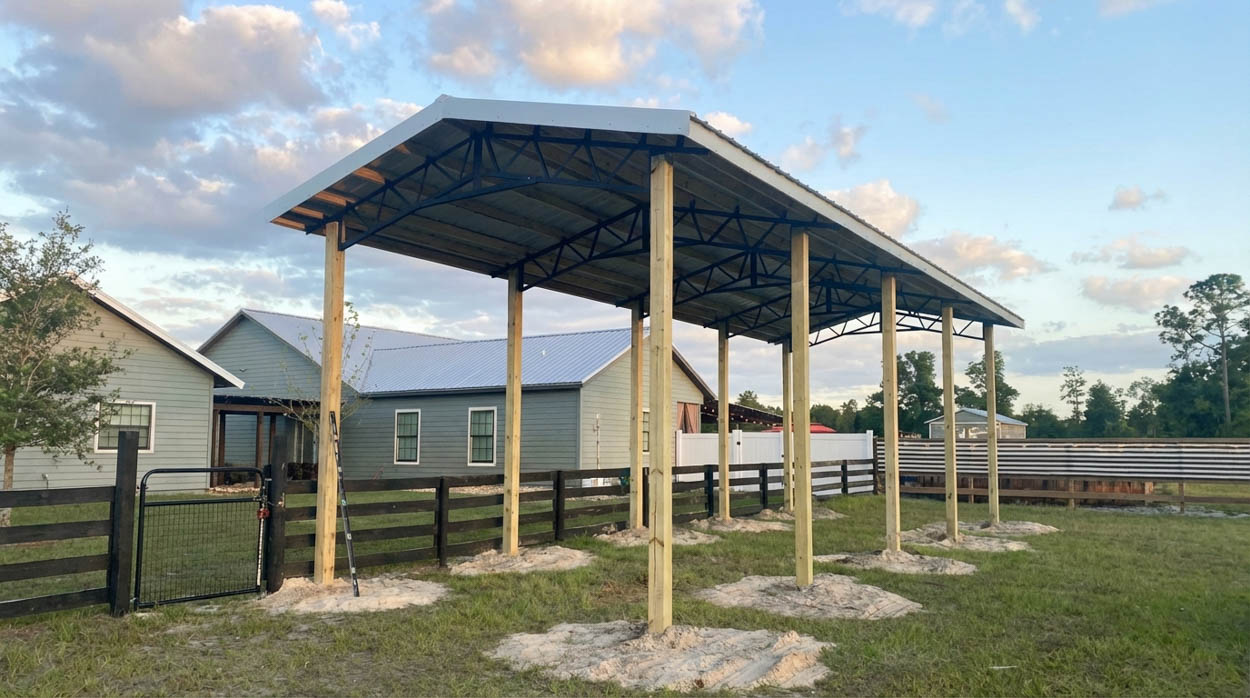 Steel pole barn installation with high-clearance design, perfect for equipment, vehicles, and commercial operations in Florida.