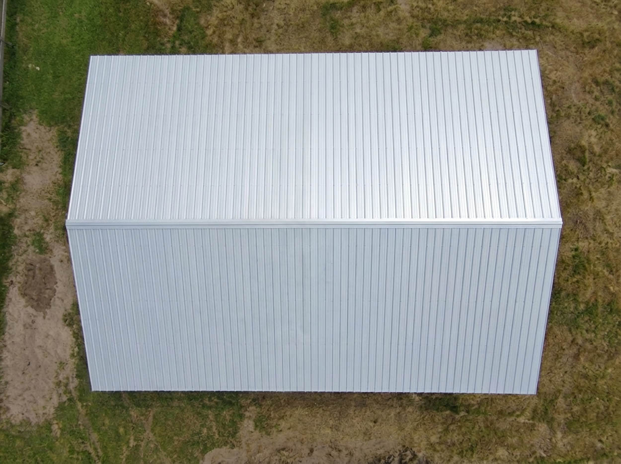 Aerial view of metal roof pole barn construction, showcasing professional steel building installation in Florida.
