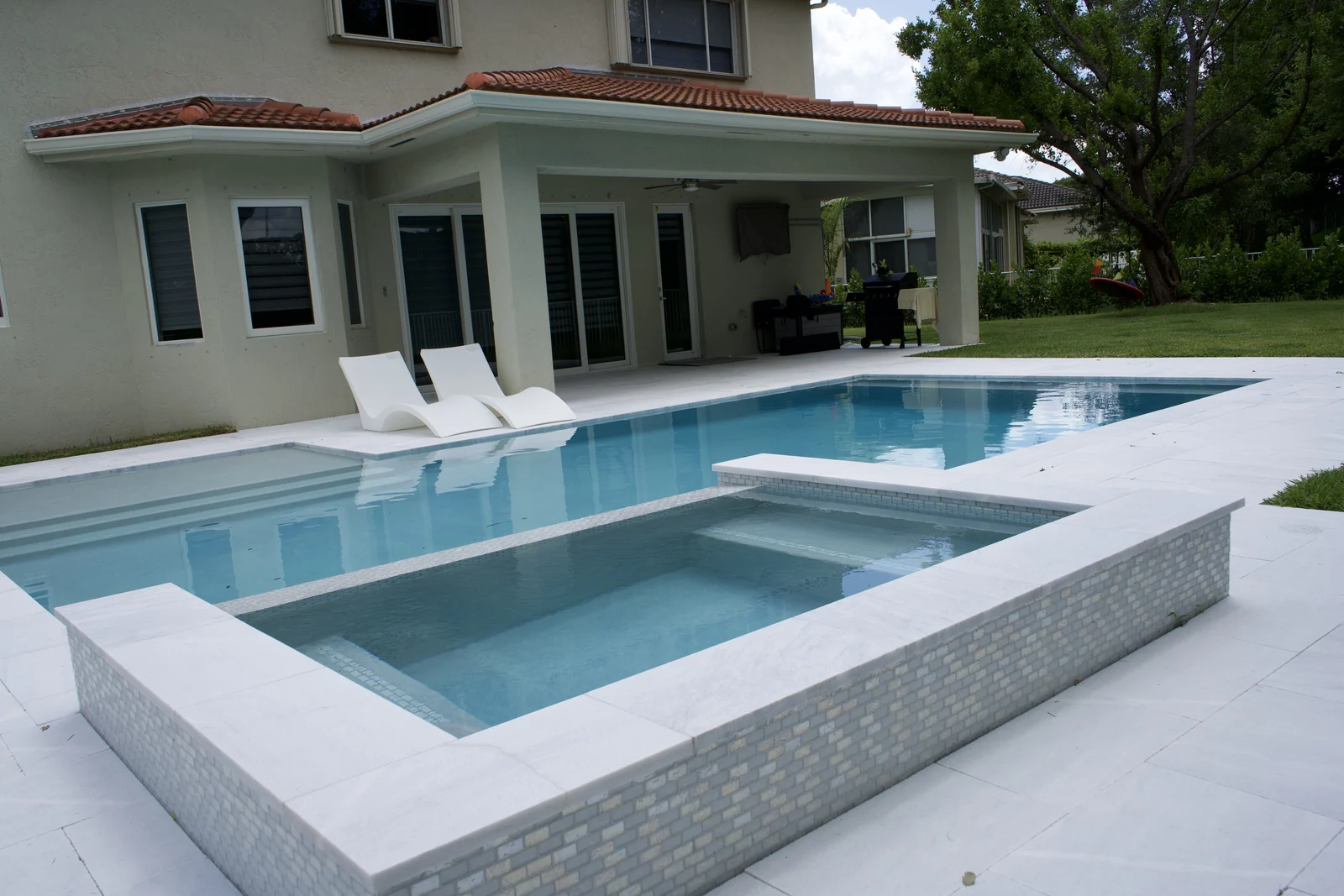 Completed backyard pool with raised spa