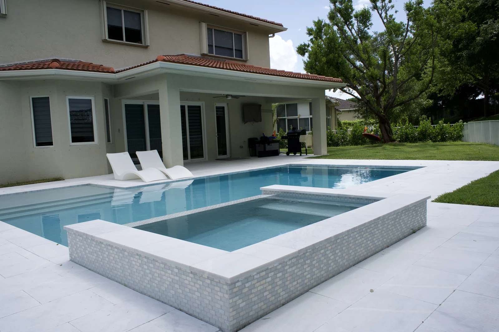 Completed backyard pool with raised spa