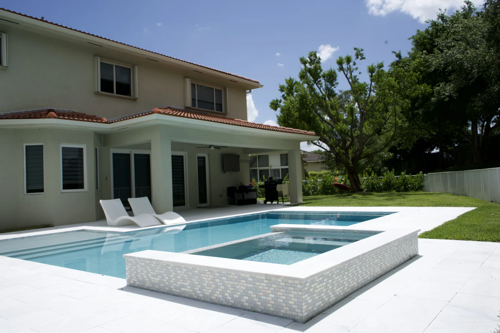 Completed backyard pool with raised spa
