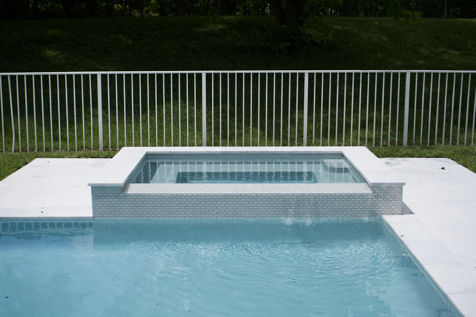 Completed backyard pool with raised spa